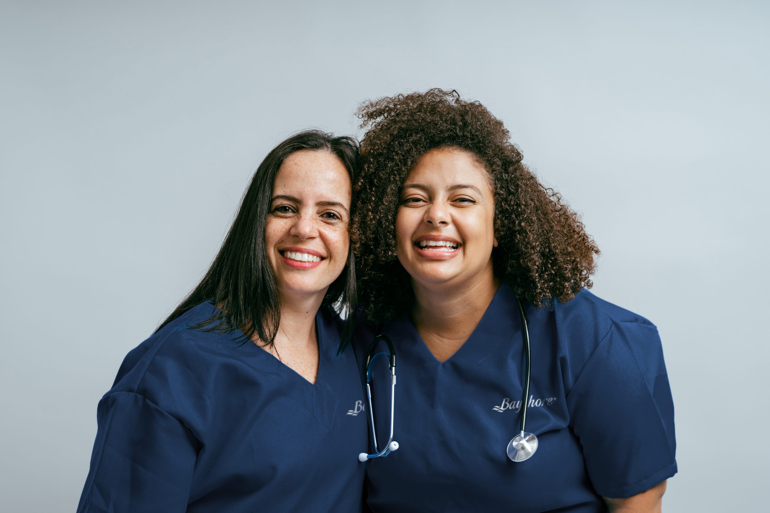 Two smiling young female nurses