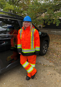 Anna Lisowska, Occupational Therapist, Bayshore Therapy & Rehab, wearing a safety uniform to accompany her client on an active train track