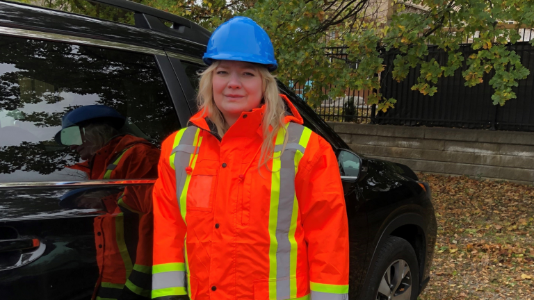 Anna Lisowska, Occupational Therapist, Bayshore Therapy & Rehab, wearing a safety uniform to accompany her client on an active train track